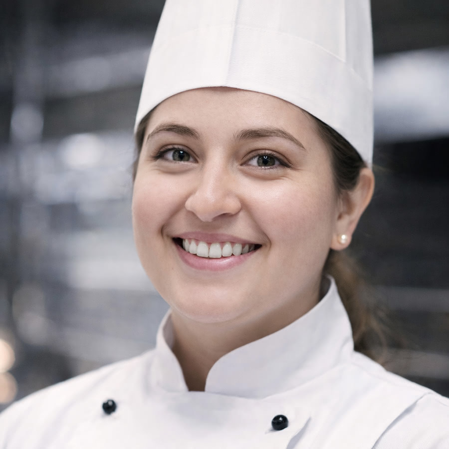 Carlos Bakery team member preparing baked goods